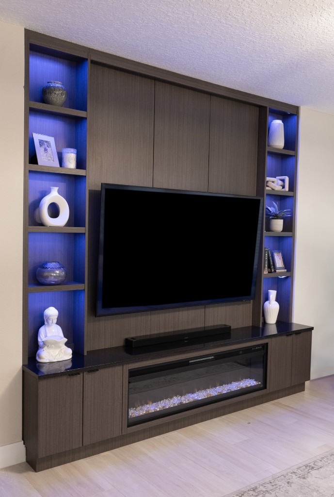 Custom home bar with dark wood cabinetry and granite countertop — club room conversion Orlando